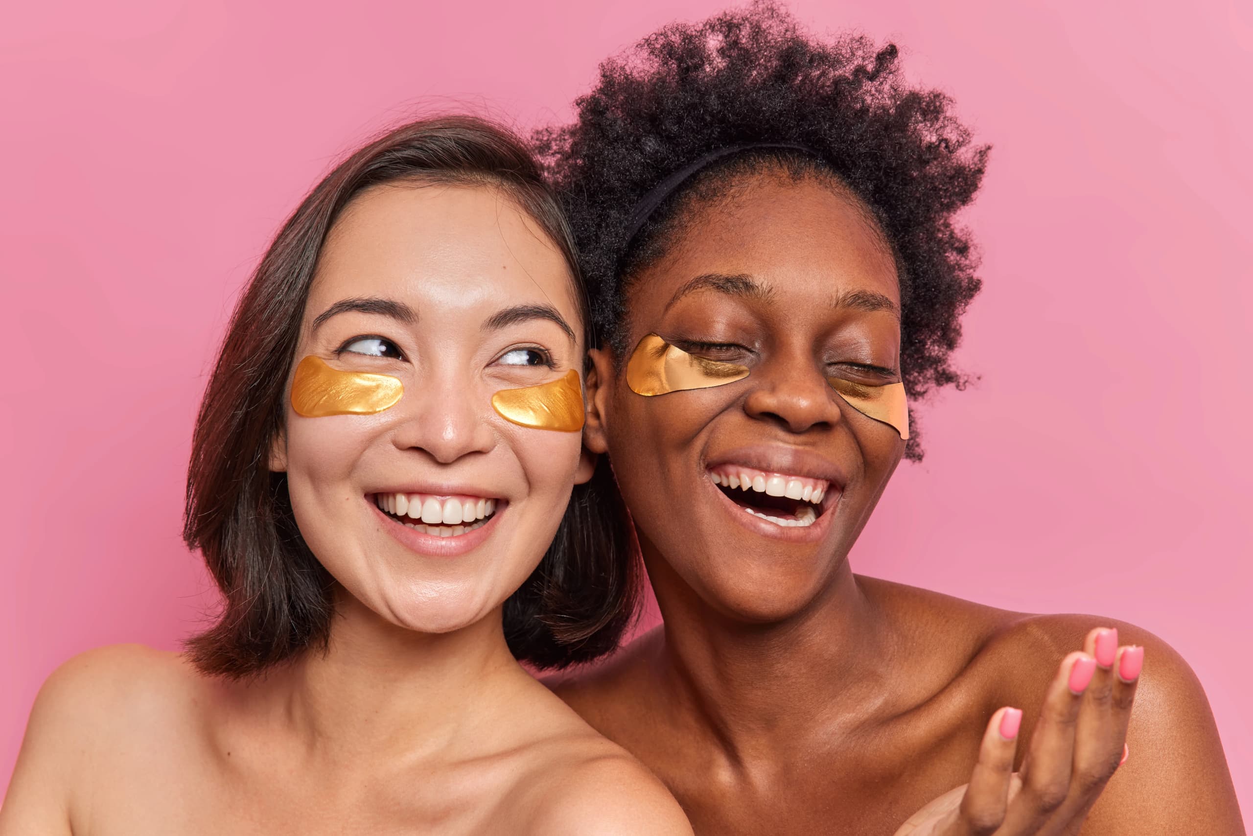 image of two women using under eye patches
